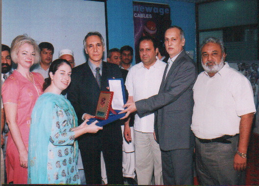 SCCI President Amer B.Azam & Manzoor Malik Former President presenting Footbal Souvenir to Ms. Jessica Berlow, Economic Officer of American Consulate 